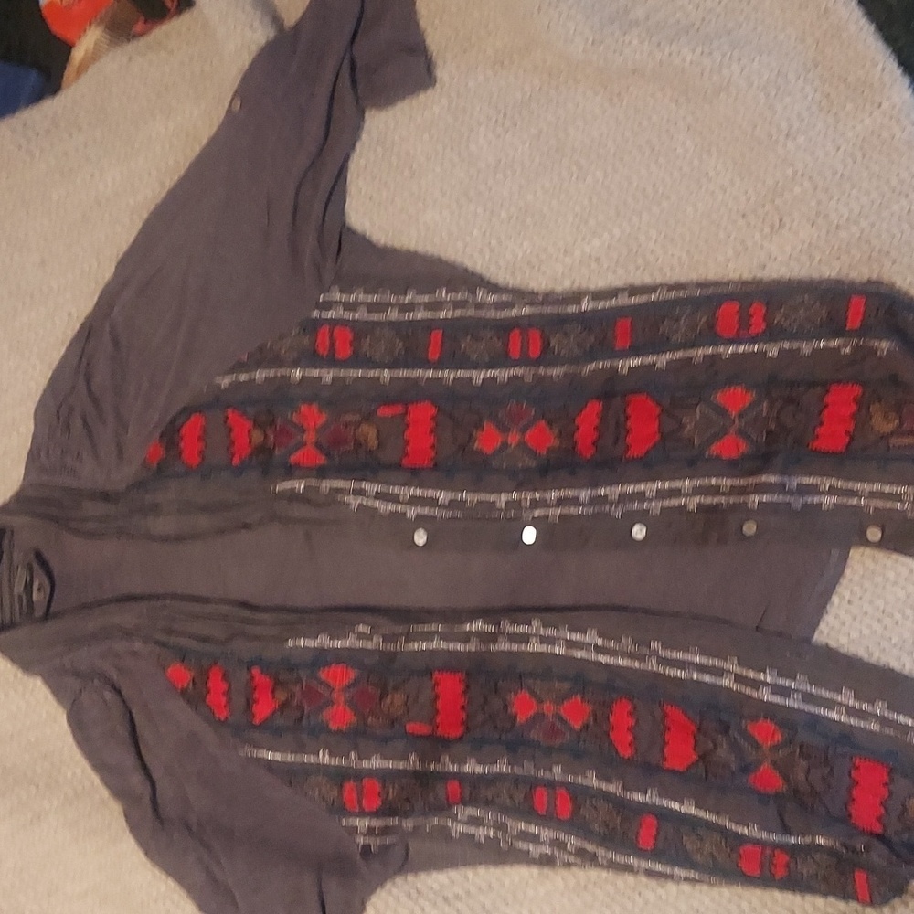 South western / tribal vibes on this colorful embroidered button up